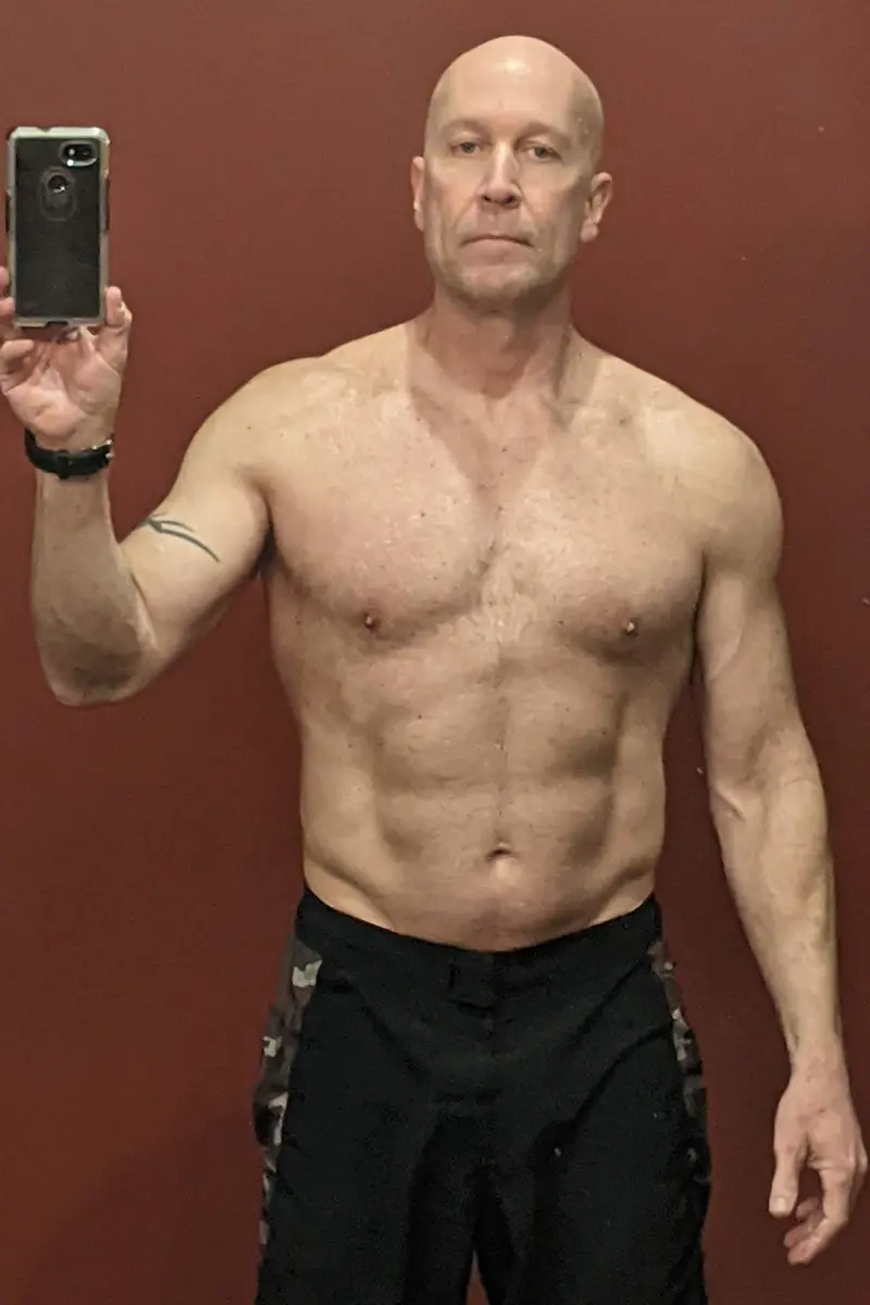 Coach Rob Yahn in his mid 50s, lean and muscular, in a mirror photo.