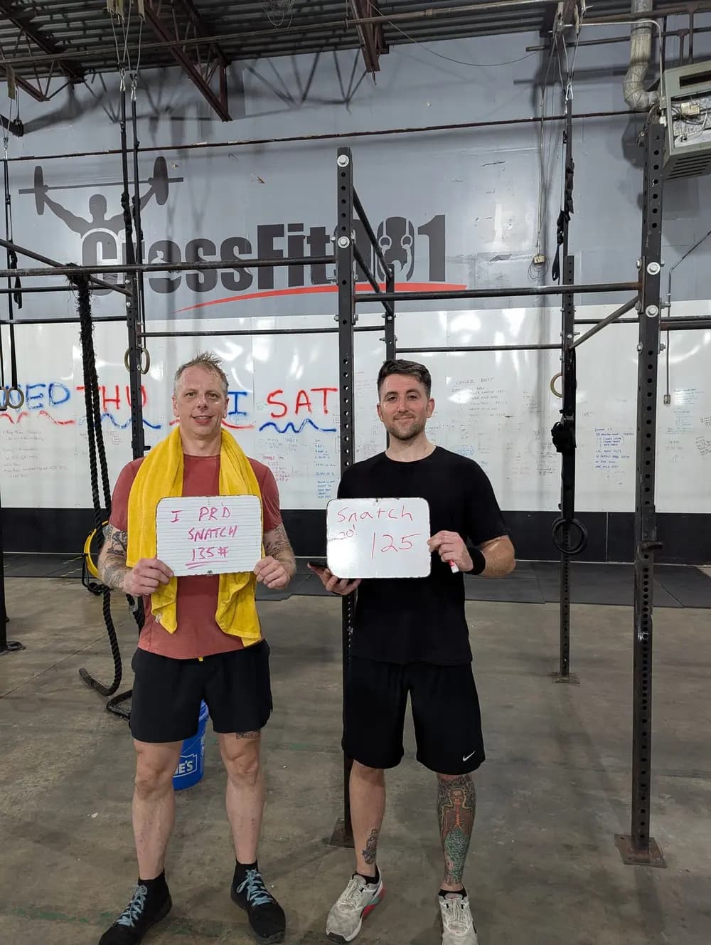 Matt and Josh, training partners, celebrating a snatch personal record at Fit 901.
